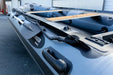 Stryker LX 380 inflatable boat side view with padle.